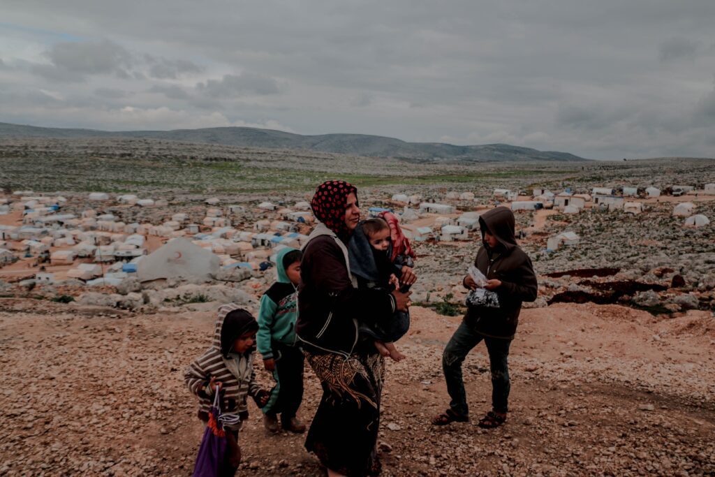 a mother of the persecuted church walks with her children