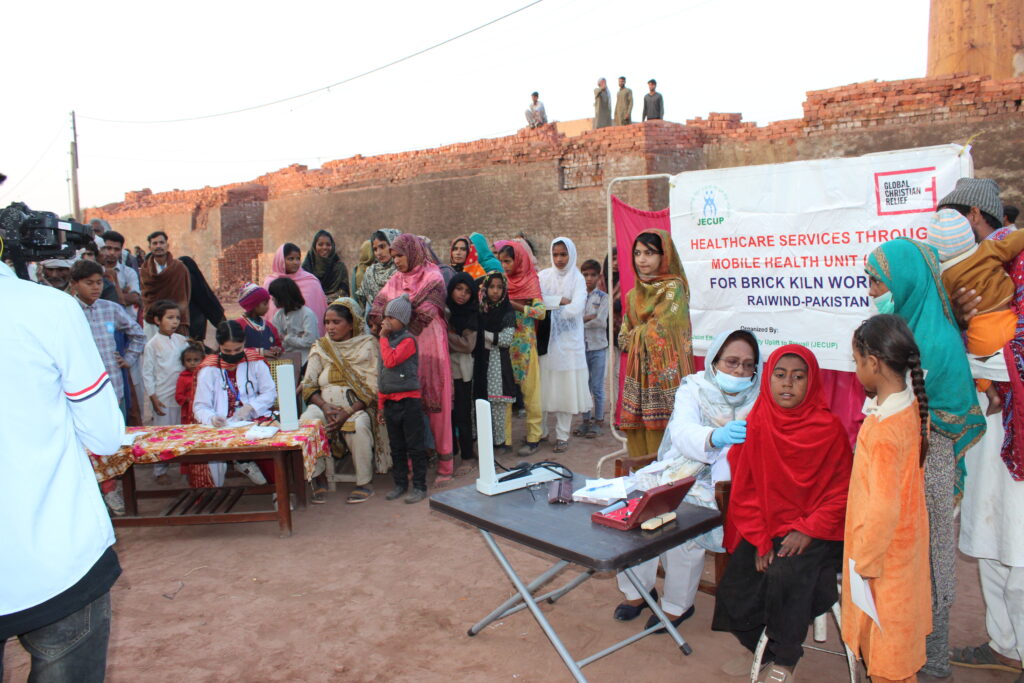 Impoverished Christians in Pakistan attend a free mobile health clinic.