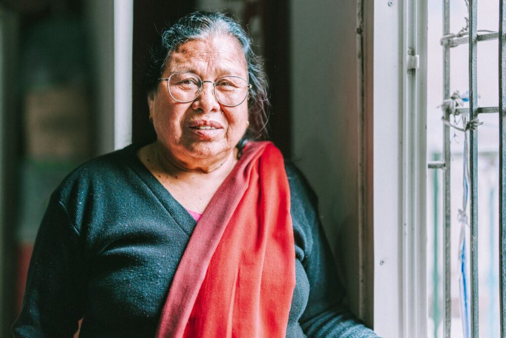 A portrait of Pulmaya, a new Christian convert and former witch doctor, who explored religion in Nepal
