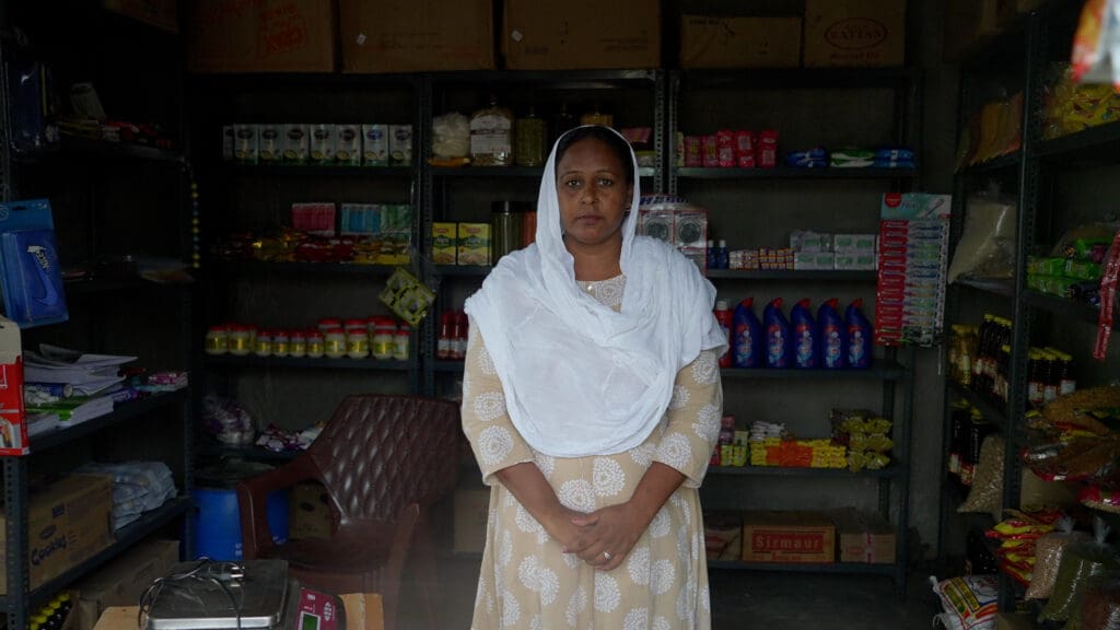 Simran in front of the shop