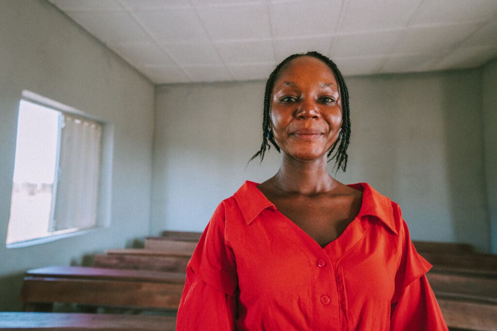 Empowered through education, Esther gives back to her community of displaced Nigerian Christians.