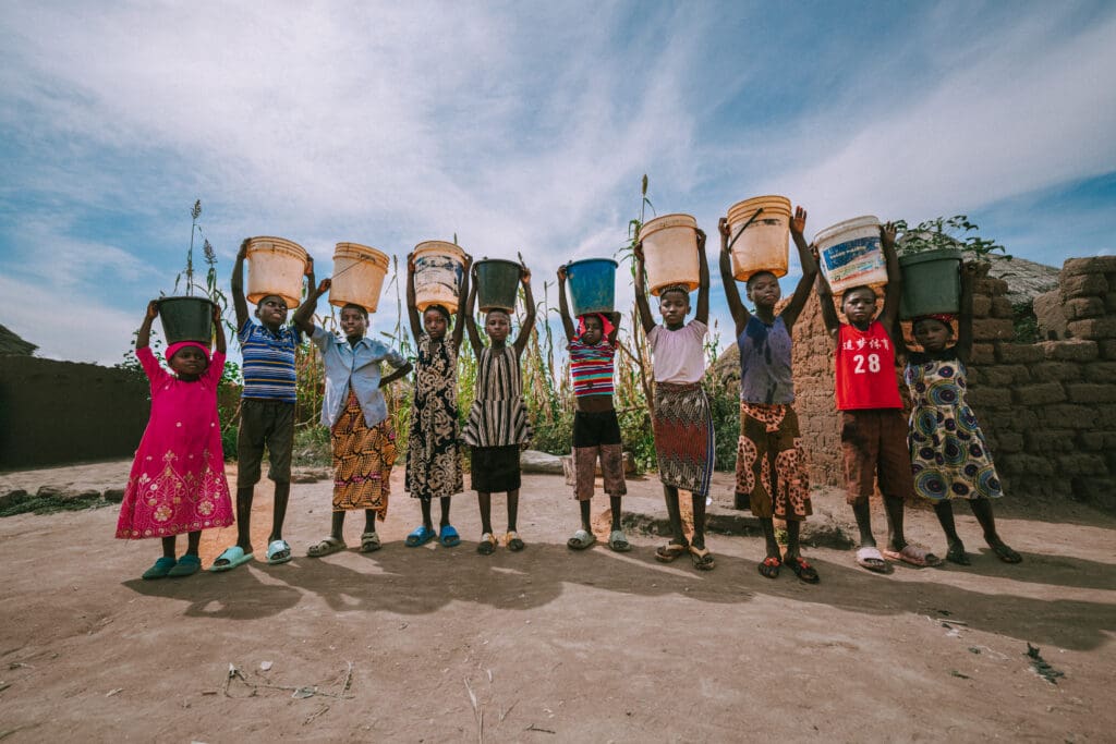 Helping the poor in action - Nigerian persecuted Christians receive water from a new clean well