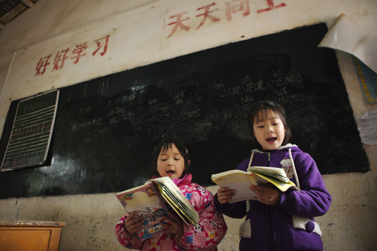 With a spirit of eager learning, these young students engage with their lessons, reflecting hope for the future. Their dedication reminds us of the power of education and faith in challenging environments.