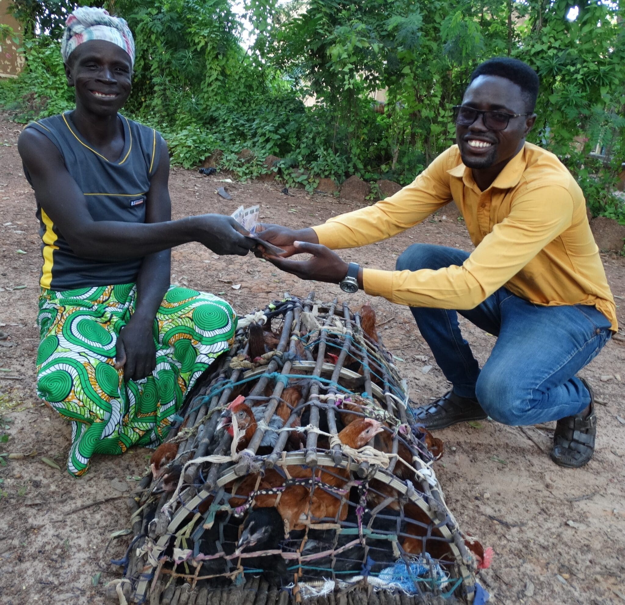 A believer in Burkina Faso receives a chicken coop for income generation