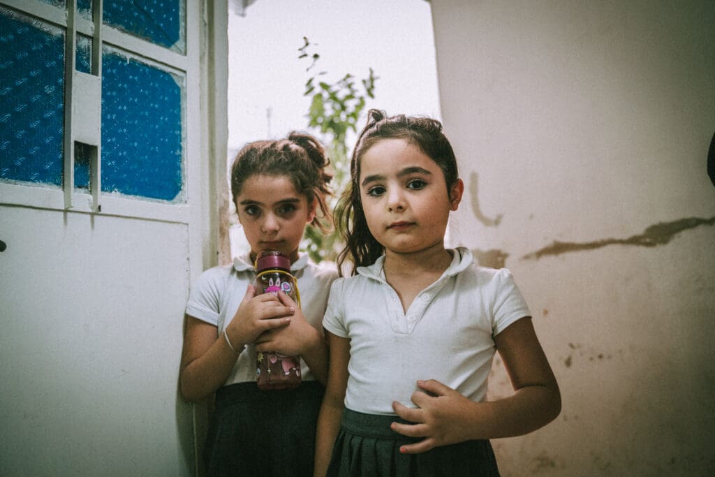 Two little girls children, survivors of bombing at Mar Elias Church in Damascus Syria