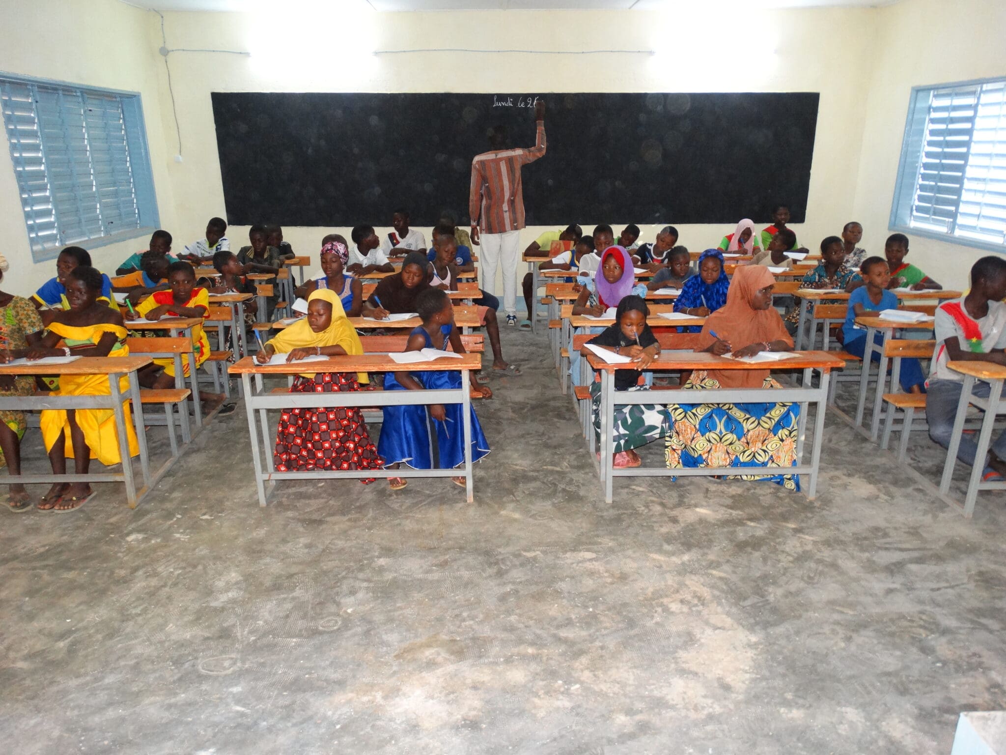 Children attend class inside newly renovated school building in Burkina Faso