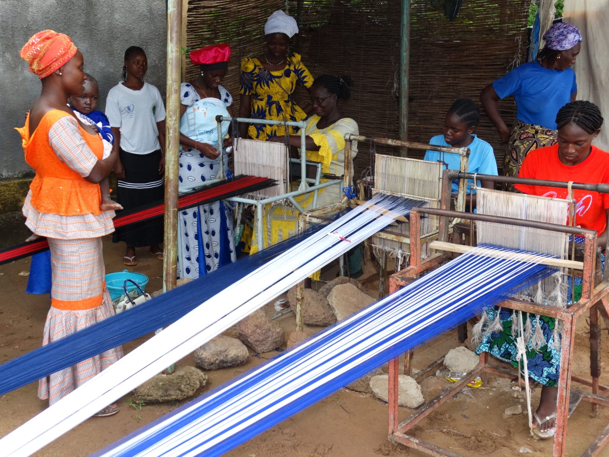 Women receive training and weaving looms to create income